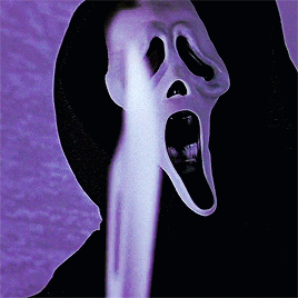 Ghostface from the movie Scream on a blue background. He brings a knife into view, before tilting his head to the side, confused